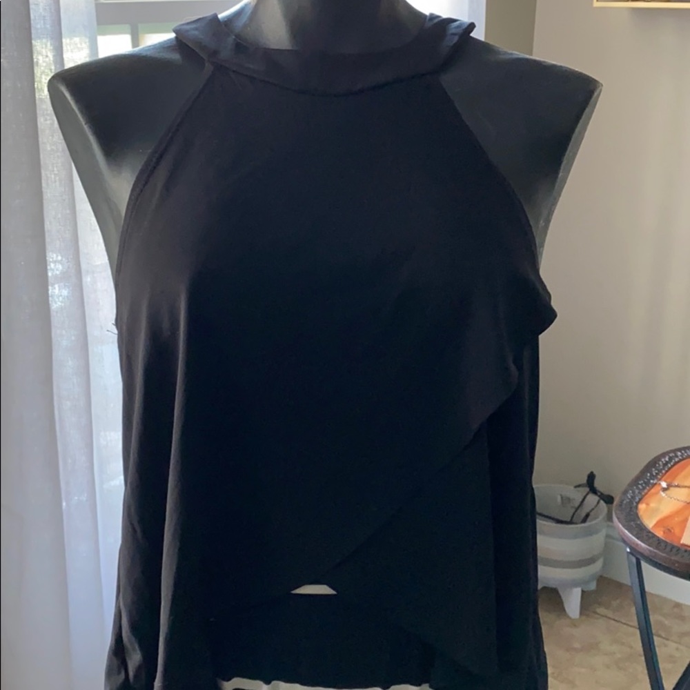 A black sleeveless top with a crossover design.